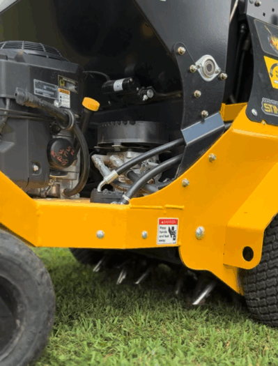 Close up of lawn aeration machine for promoting root growth in lawns