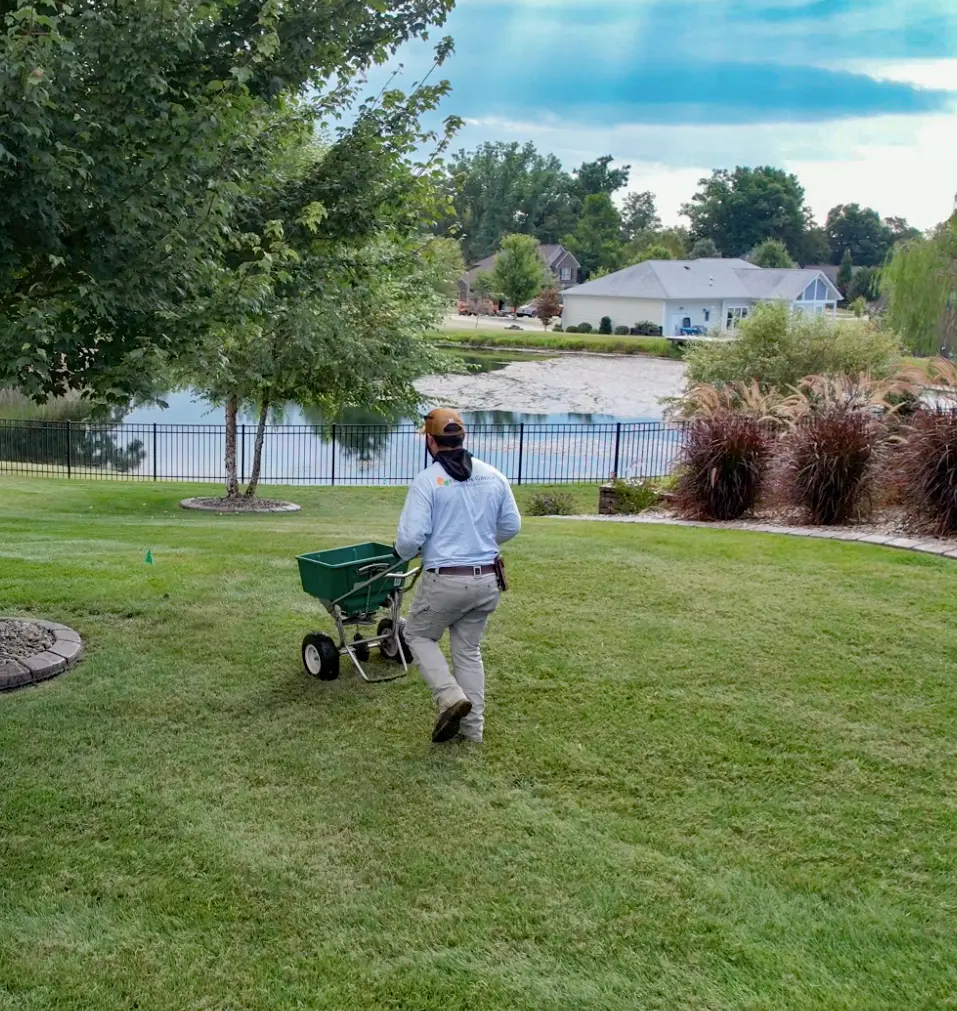 The Fransen Group Landscaping Company fertilizing turf and controlling the growth of weeds