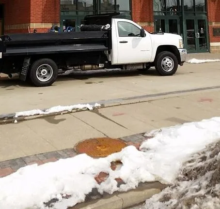 Sidewalk being de-iced in Louisville KY outside of Slugger Field