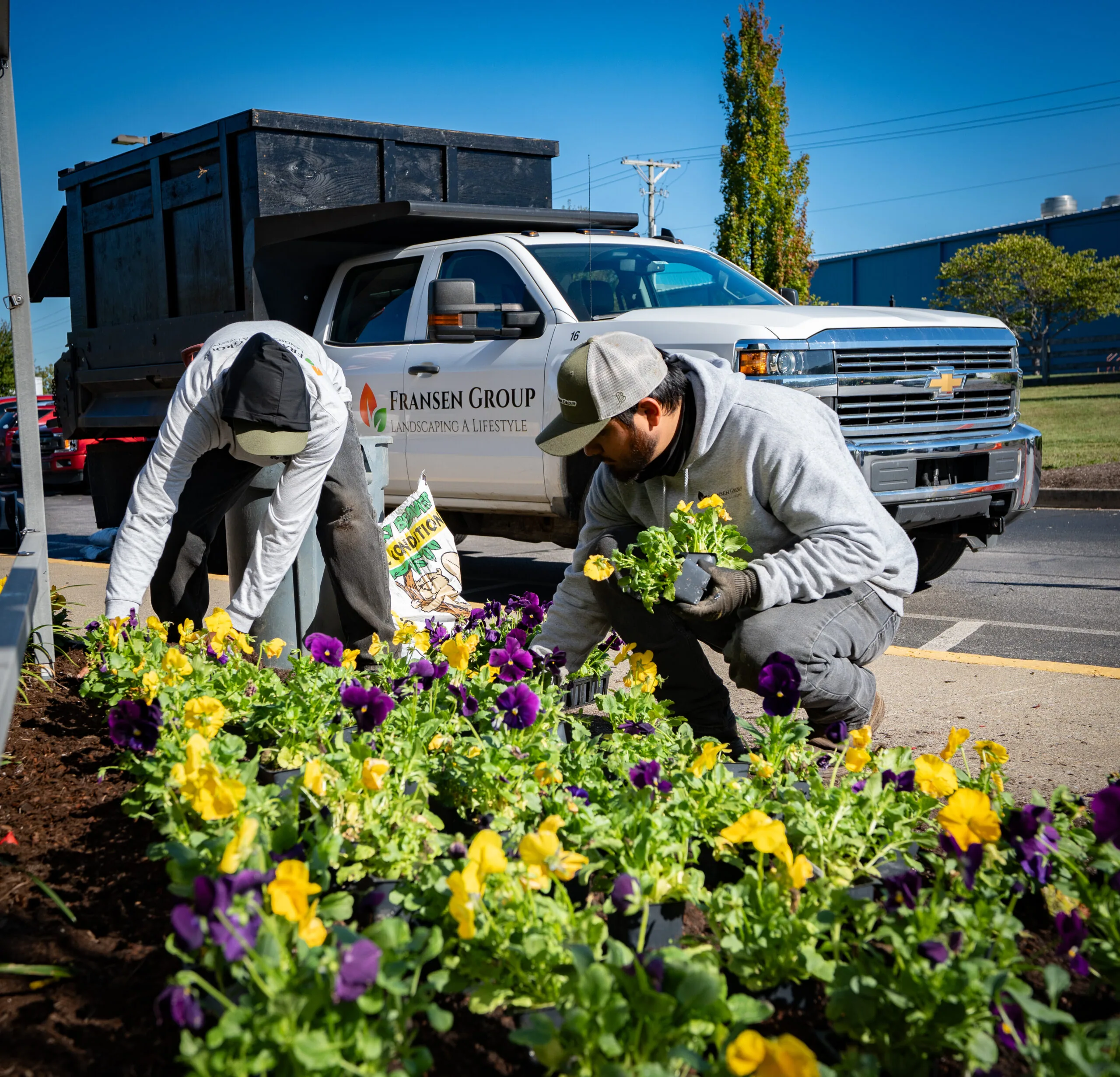 The Fransen Group planting flowers