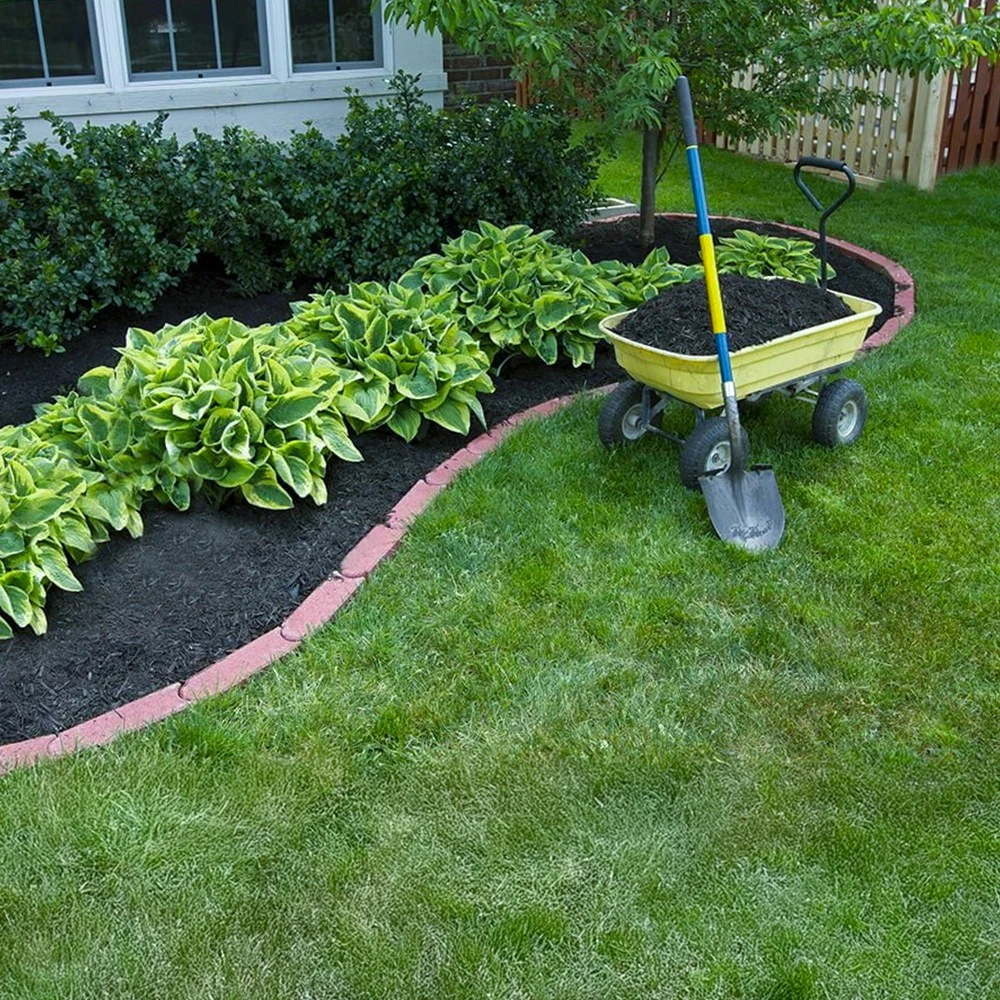 Fransen Group Landscaping Company mulching during a spring fall cleanup